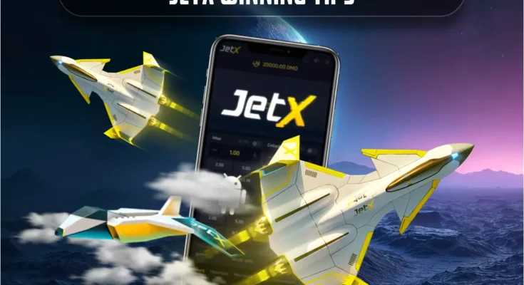 Three futuristic jets soar around a smartphone displaying the JetX game interface, with "JetX Winning Tips" showcased above for players seeking the best JetX strategies
